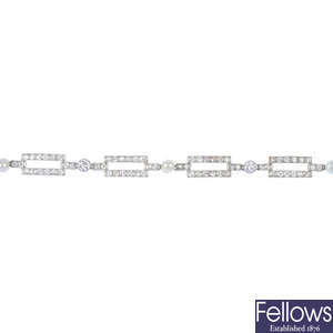 A diamond and cultured pearl bracelet.