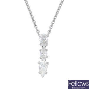 A diamond three-stone necklace.