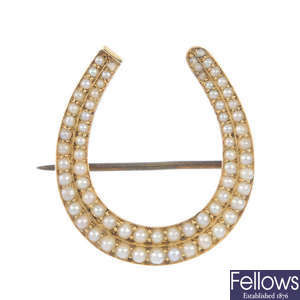 A late 19th century gold split pearl horseshoe brooch.