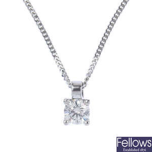A diamond single-stone pendant. 