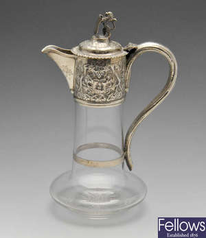 A late Victorian silver mounted claret jug. 
