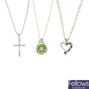A selection of three gold gem-set pendants. 
