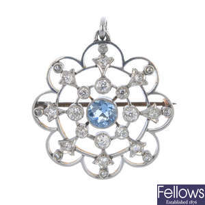 An early 20th century platinum and gold aquamarine and diamond pendant.