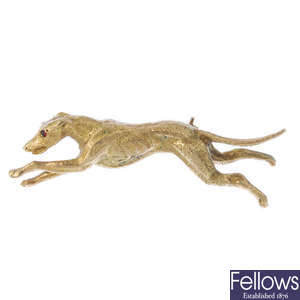 A 9ct gold greyhound brooch.