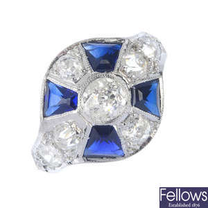 An early 20th century 18ct gold and platinum diamond and synthetic sapphire dress ring.