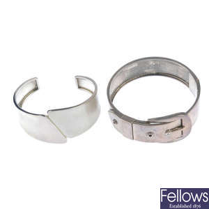 A selection of seven silver and white metal bangles.