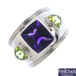 THEO FENNEL - an amethyst and peridot three-stone ring. 