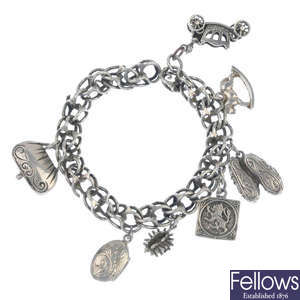 A selection of charms and broken charm bracelets.