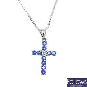 A sapphire and diamond cross pendant, with an 18ct gold chain.
