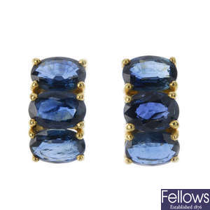 A pair of sapphire ear pendants.