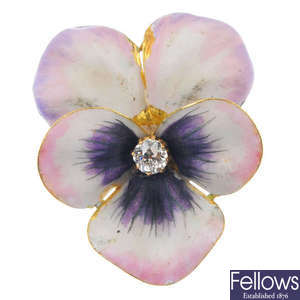 An early 20th century 18ct gold diamond and enamel viola brooch. 