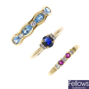 A selection of four 18ct gold diamond and gem-set rings.