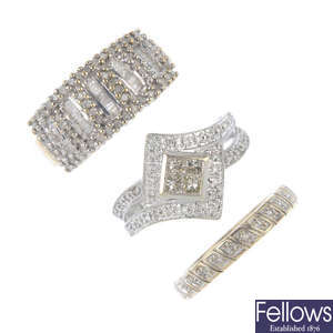 A selection of three 14 and 9ct gold diamond rings.