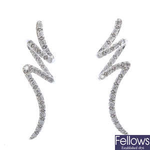 Three pairs of diamond ear studs, together with a single ear hoop. 