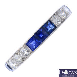 An 18ct gold sapphire and diamond half-circle eternity ring