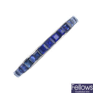 A mid 20th century sapphire and synthetic sapphire full-circle eternity ring.
