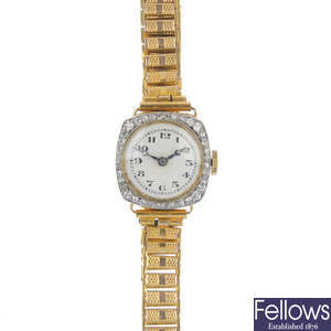 A lady's early 20th century 18ct gold diamond manual wind wristwatch.