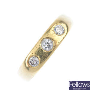 A gentleman's 18ct gold diamond three-stone ring.