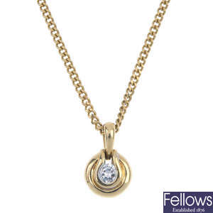 A gold diamond pendant.