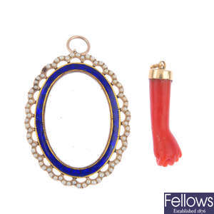 An early 20th century split pearl and enamel photograph pendant and a coral pendant.