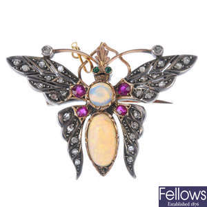 A gem-set moth brooch.