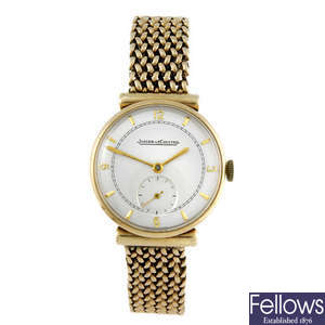 JAEGER-LECOULTRE - a gentleman's 9ct yellow gold bracelet watch.
