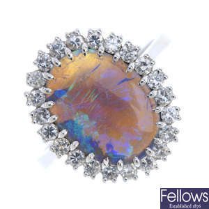 A black opal and diamond cluster ring. 
