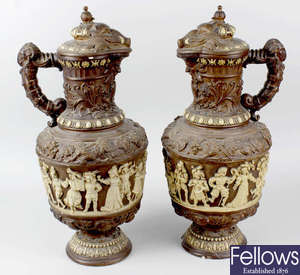 A large pair of 19th century relief moulded ewers