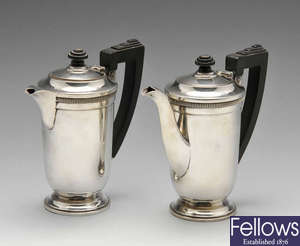 A pair of silver Art Deco cafe au lait pots.