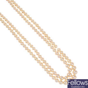 Three cultured pearl necklaces.