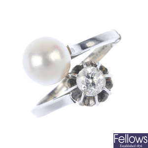 A diamond and cultured pearl crossover ring.