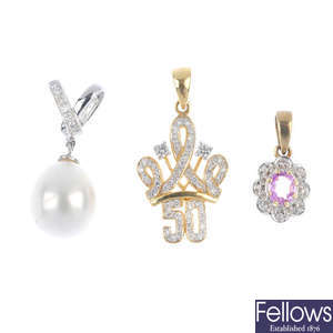 A selection of four diamond and gem-set pendants.