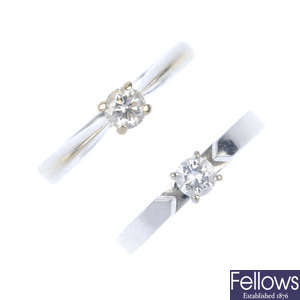 Two diamond single-stone rings.