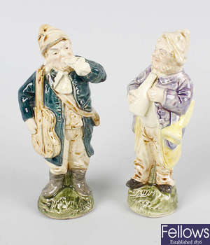A pair of glazed pottery figures
