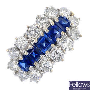 An 18ct gold sapphire and diamond cluster ring. 