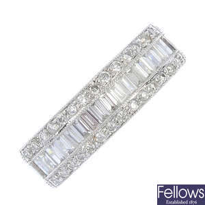 An 18ct white gold ring set with one row of baguette cut and two rows of brilliant cut diamonds