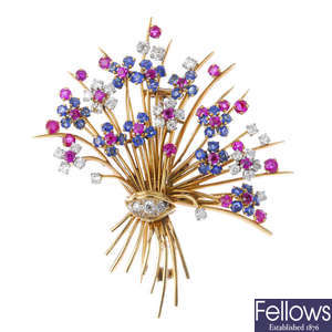 A mid 20th century diamond, sapphire and ruby floral spray brooch.