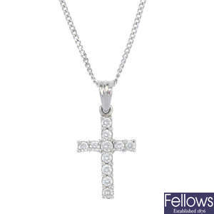 A platinum diamond cross pendant.