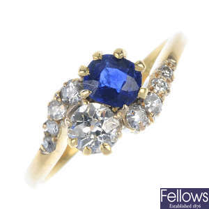 An early 20th century 18ct gold sapphire and diamond two-stone crossover ring. 