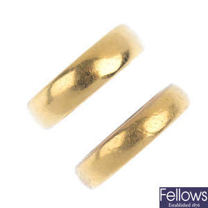 Two early to mid 20th century 22ct gold band rings.