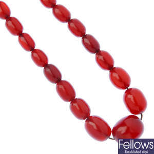 A red plastic bead necklace.