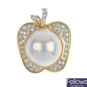 A mabe pearl and diamond apple pendant.