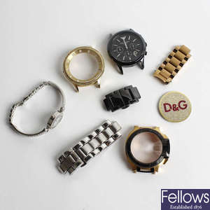 A quantity of watch parts and broken watches.