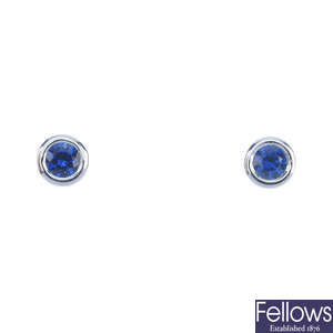 A pair of sapphire single-stone ear studs.