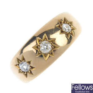 A late Victorian 18ct gold three-stone dress ring.