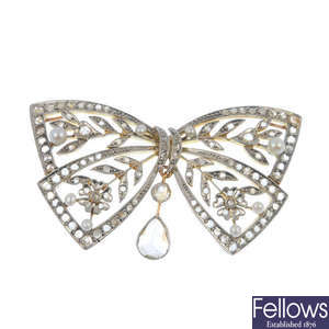 A late 19th century platinum and gold, diamond and seed pearl bow brooch.