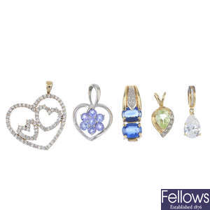A selection of five gem-set pendants.