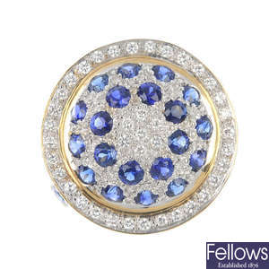 An 18ct gold sapphire and diamond domed cluster ring.