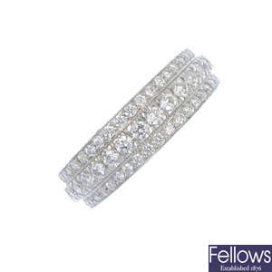 A diamond three-row dress ring.