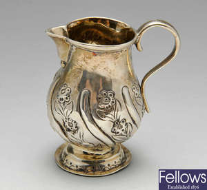 A George III silver cream jug & late Victorian silver caster.